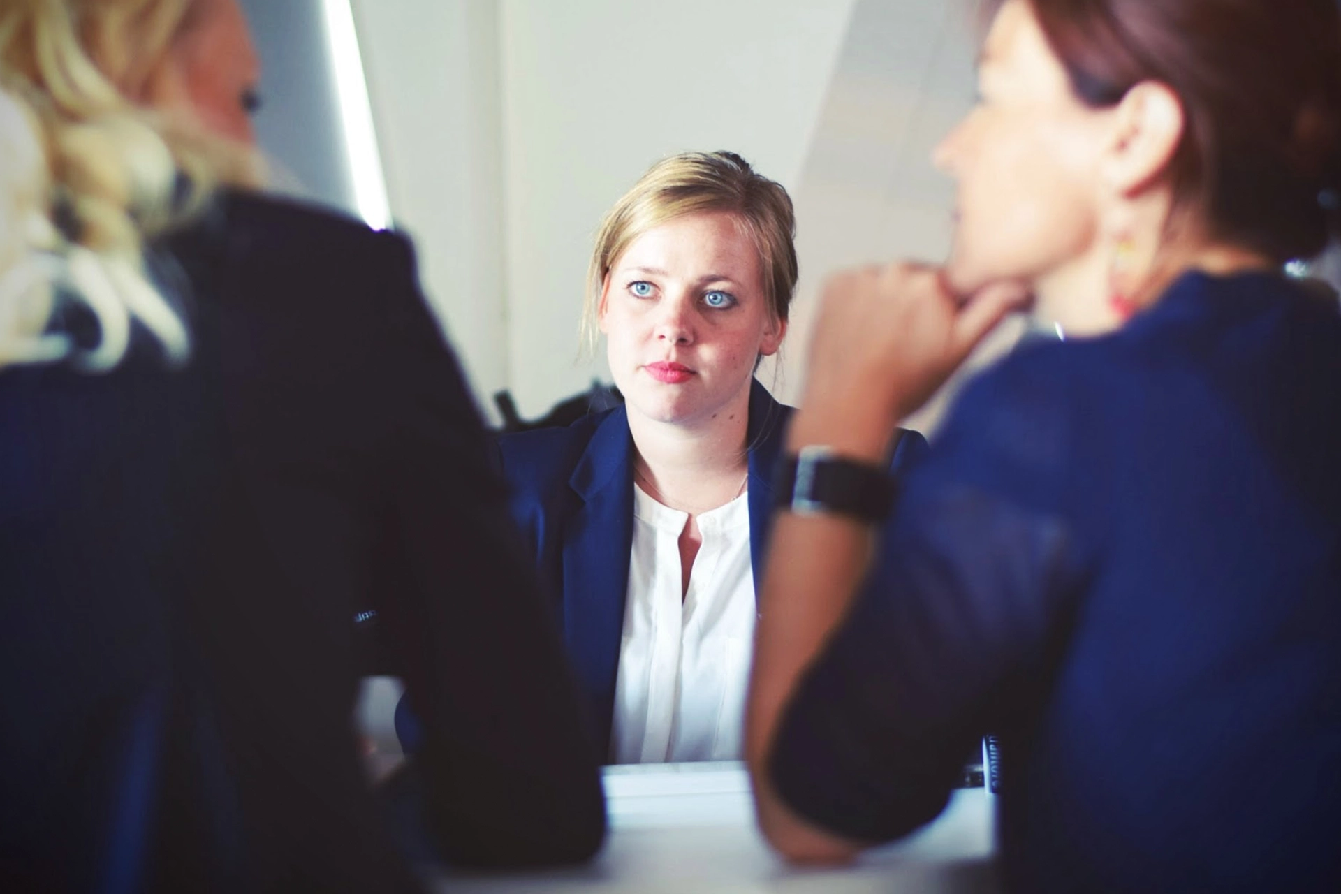 women siiting across desk in office - power of attorney